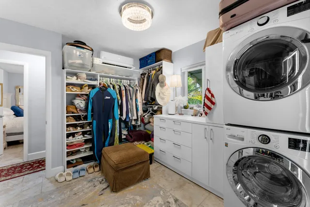 a view of a patio with table and chairs and potted plants