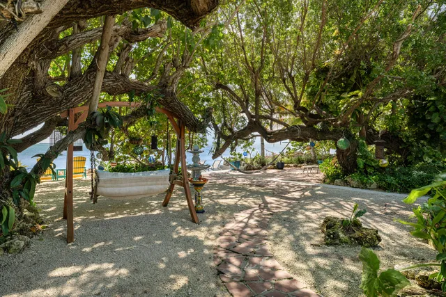 a view of a lake with houses in the back
