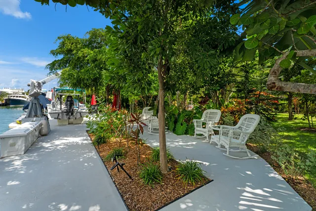 an aerial view of a house with a yard and garden