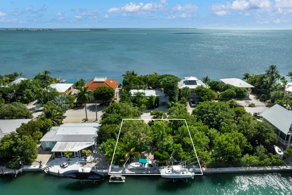 a view of a lake with a yard
