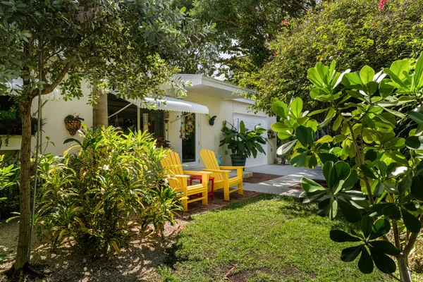 a backyard of a house with lots of green space