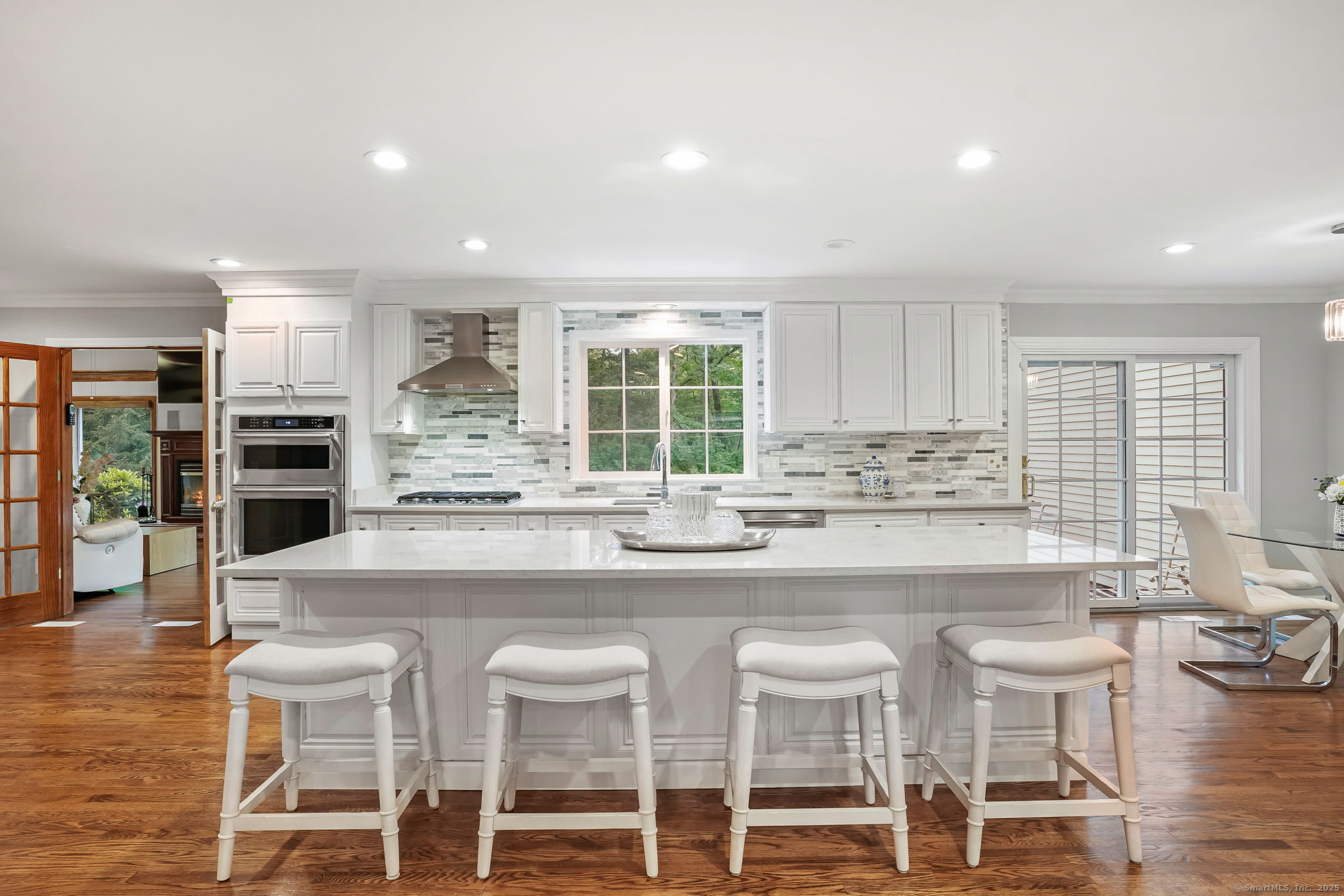 22 Fox Run Wilton, CT 06897 - Photo 18 of 40 a large kitchen with a table and chairs