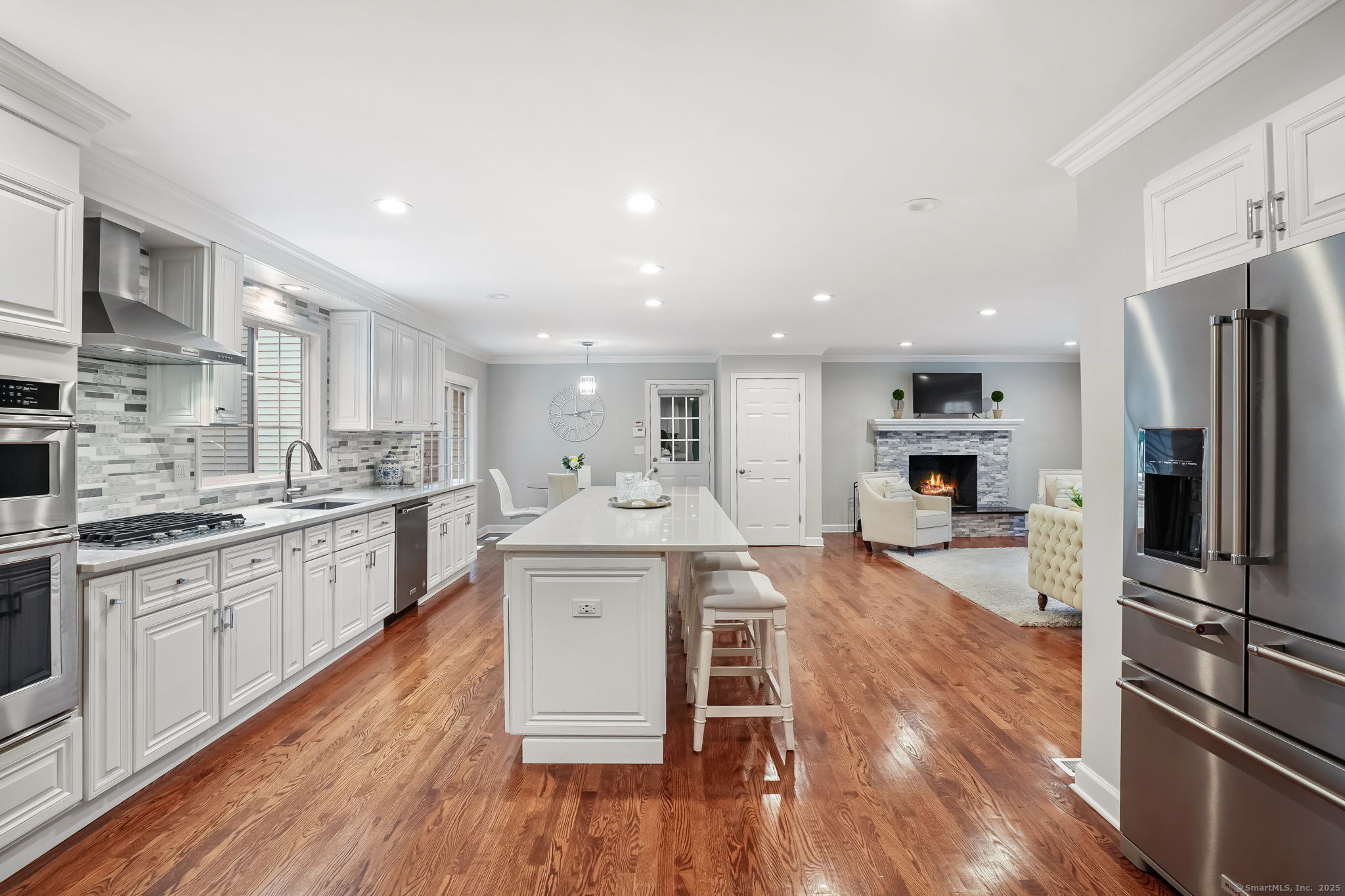 22 Fox Run Wilton, CT 06897 - Photo 19 of 40 a large kitchen with cabinets wooden floor and stainless steel appliances