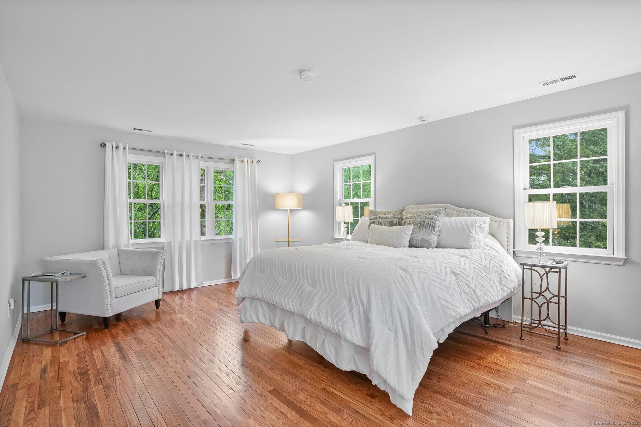 22 Fox Run Wilton, CT 06897 - Photo 26 of 40 a bedroom with a bed and a large window