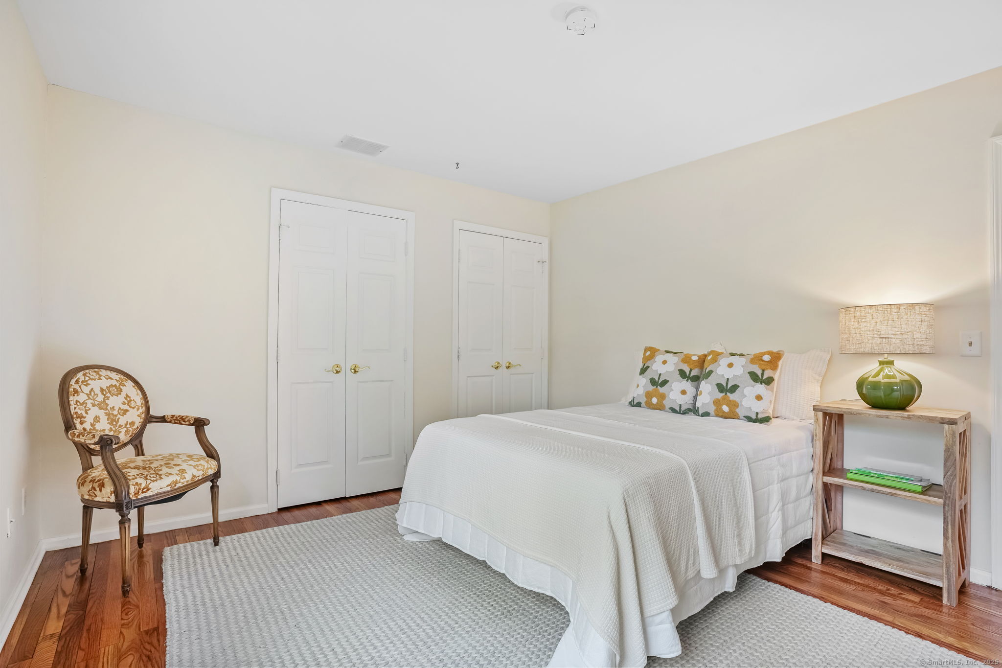22 Fox Run Wilton, CT 06897 - Photo 28 of 40 a bedroom with a bed and a table