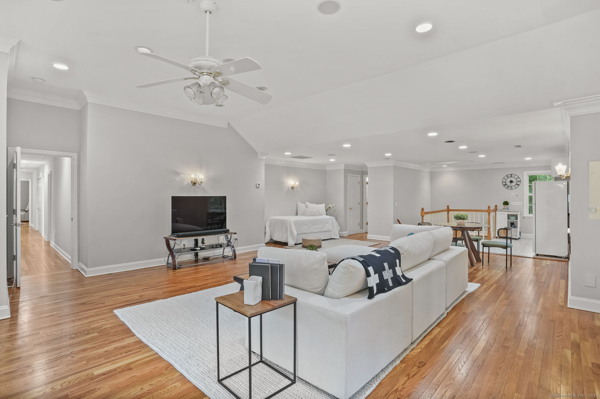 22 Fox Run Wilton, CT 06897 - Photo 32 of 40 a living room with furniture a wooden floor and a flat screen tv