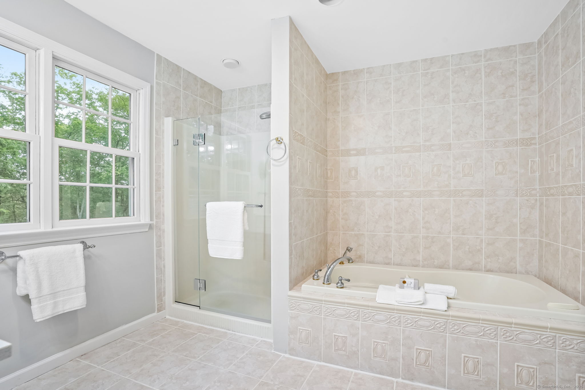 22 Fox Run Wilton, CT 06897 - Photo 35 of 40 a bathroom with a bathtub and a shower