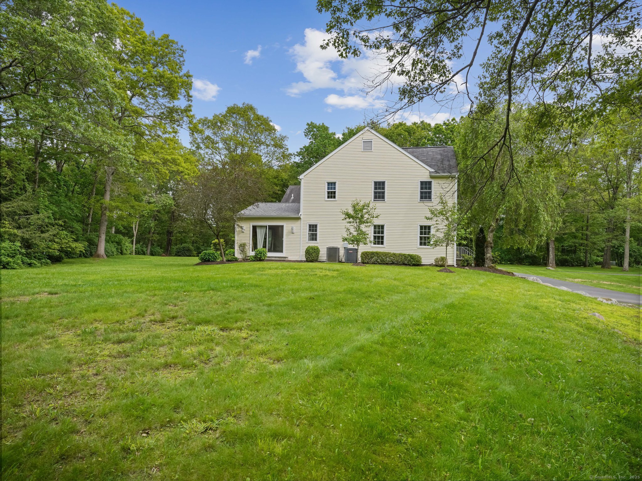22 Fox Run Wilton, CT 06897 - Photo 9 of 40 a front view of house with yard and green space
