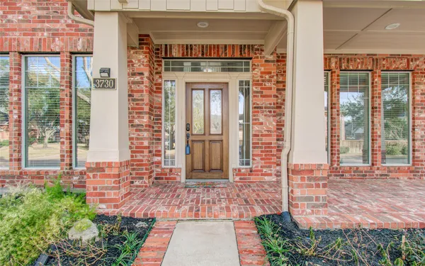 a front view of a house with a porch
