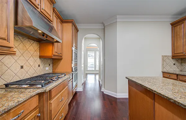 a kitchen that has a microwave and a stove