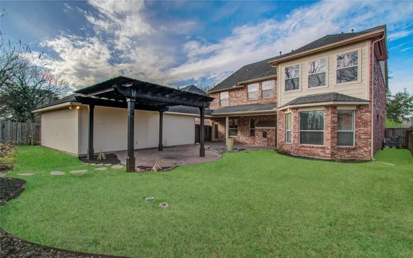 a view of a front of a house with a yard