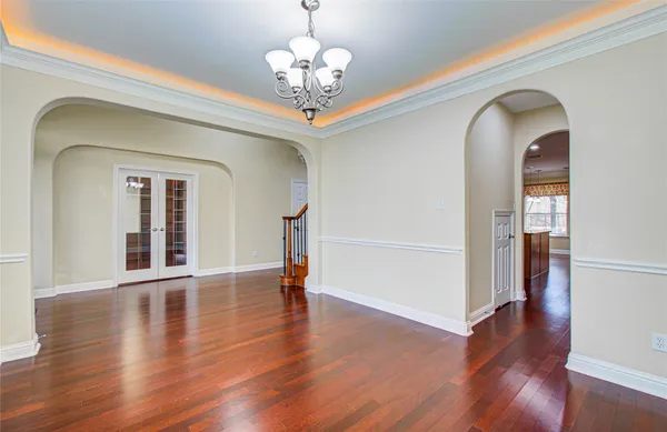 a view of an entryway with wooden floors