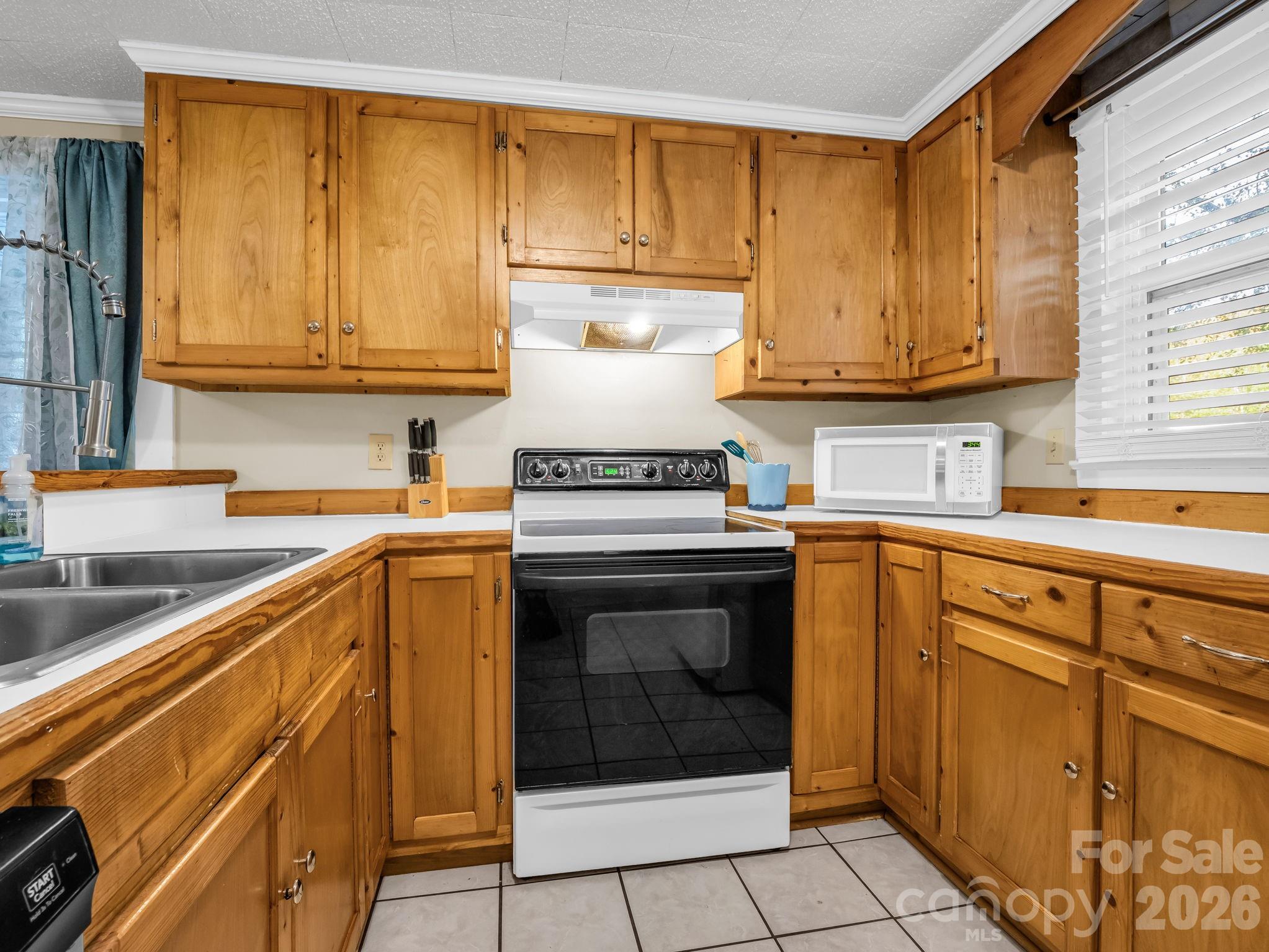 697 Bethany Church Road Forest City, NC 28043 - Photo 8 of 33 a kitchen with a sink stove and cabinets