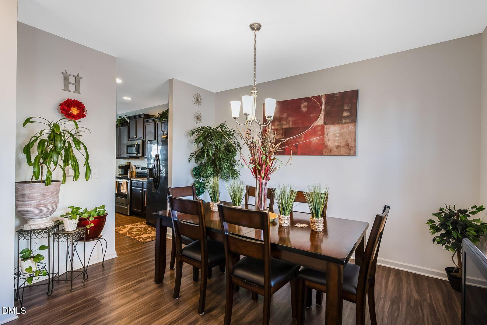 67 Prairie Street Clayton, NC 27527 - Photo 2 of 20 a view of a dining room with furniture and wooden floor