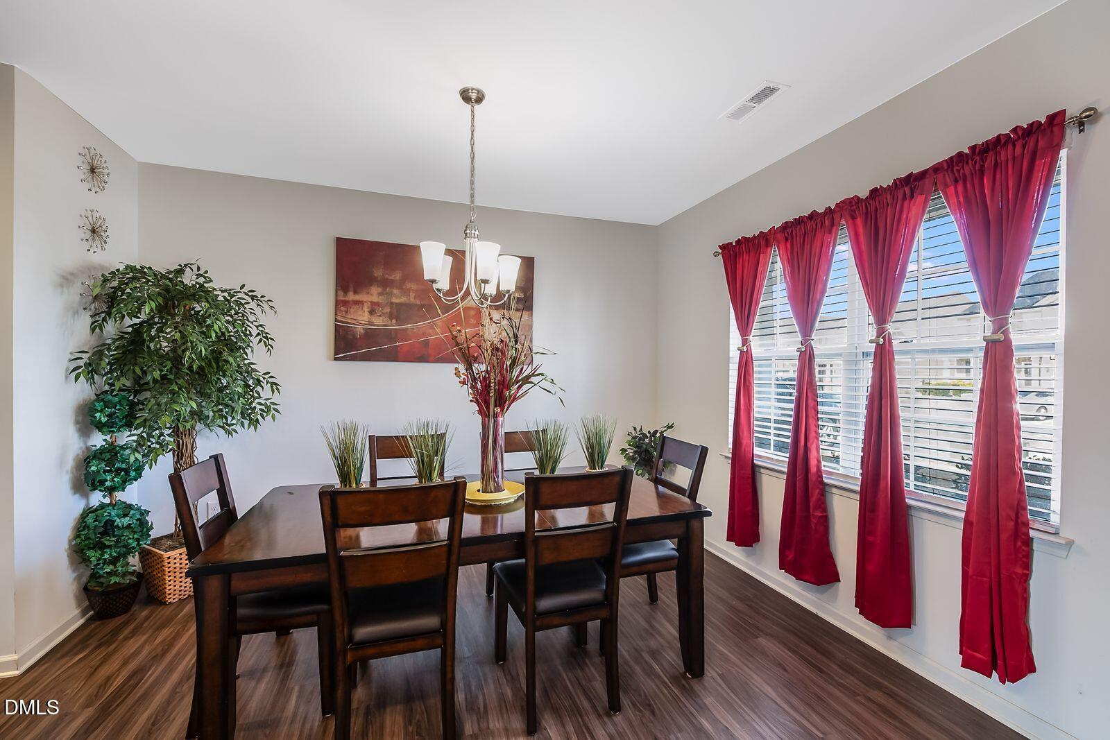 67 Prairie Street Clayton, NC 27527 - Photo 4 of 20 a view of a dining room with furniture window and wooden floor