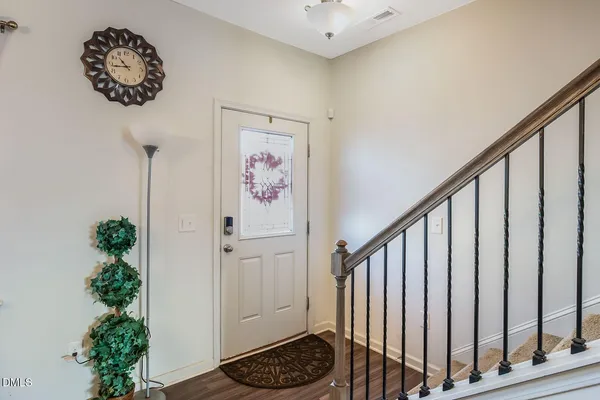 a view of entryway with wooden floor