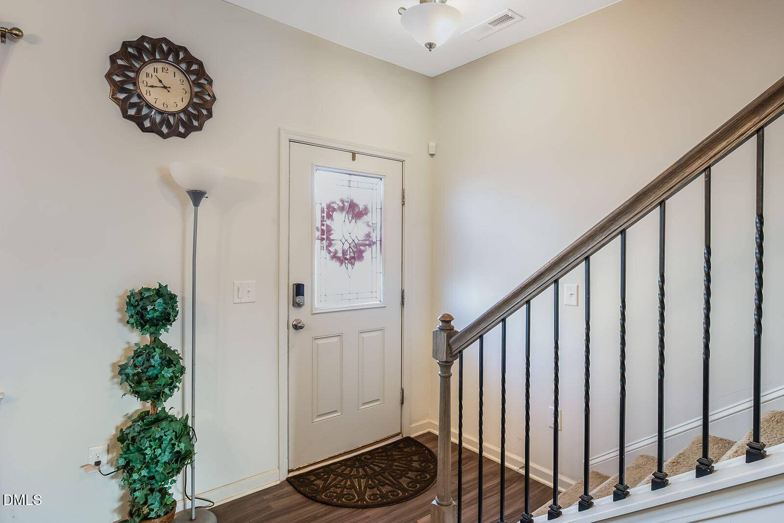 67 Prairie Street Clayton, NC 27527 - Photo 5 of 20 a view of entryway with wooden floor