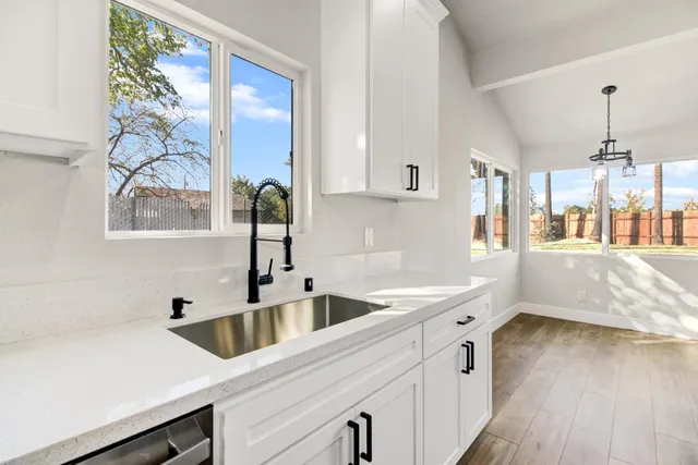 a kitchen with a sink and a window
