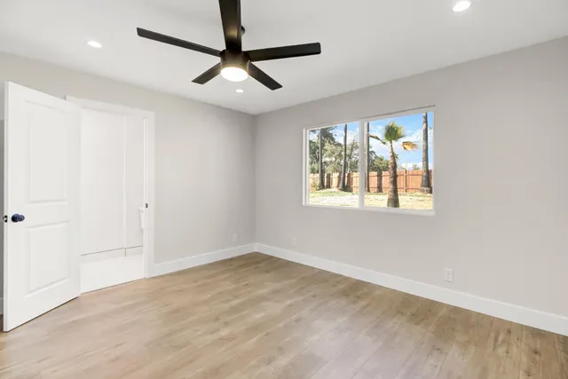 a view of an empty room with a window