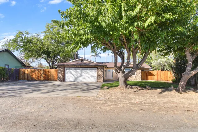 a house with trees in front of it