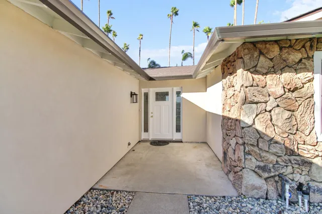 a view of a house with a snow in the background