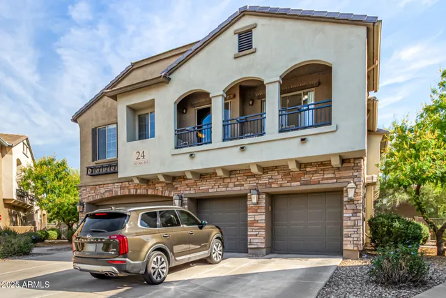 a front view of a house with parking