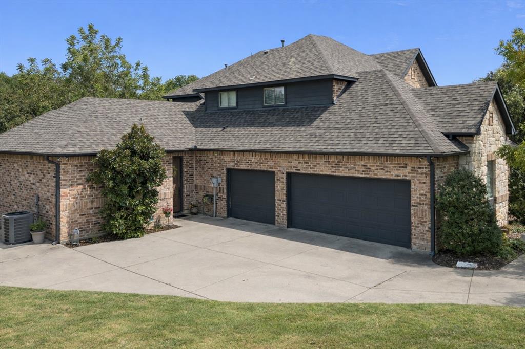 1520 Snider Court Lucas, TX 75002 - Photo 36 of 40 Spacious 3-car garage with extended driveway, providing ample parking and storage space for vehicles, equipment, or hobbies.