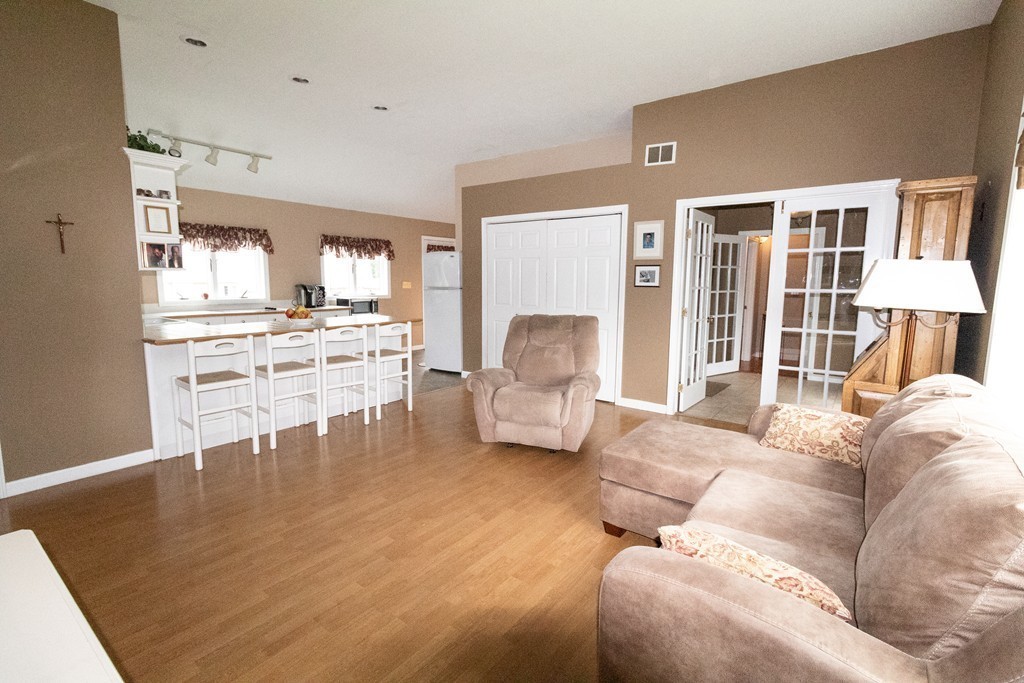 44 Flint Road Tyngsborough, MA 01879 - Photo 6 of 29 a living room with furniture and a large window