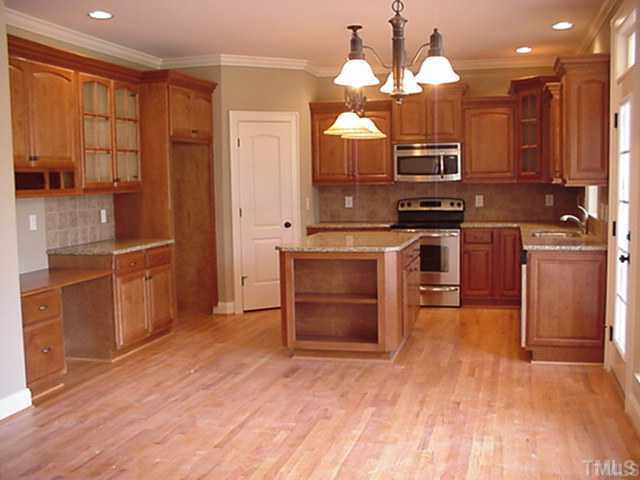 60 North Sunset Ridge Drive Willow Spring, NC 27592 - Photo 5 of 12 Chef's dream kitchen with granite, stainless appliances Kitchen