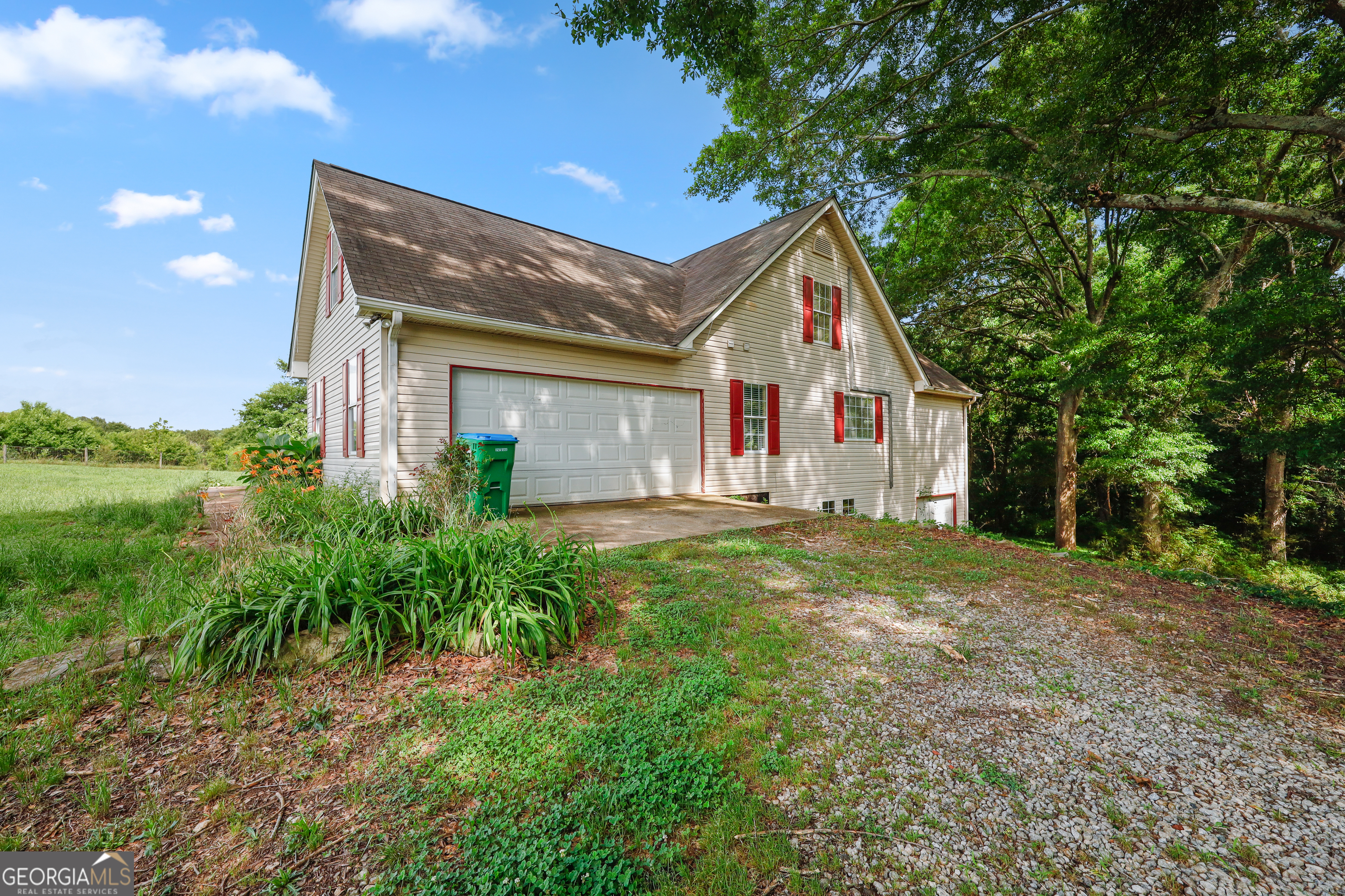 2433 Bear Creek Road Statham, GA 30666 - Photo 53 of 58 a view of a house with backyard and garden