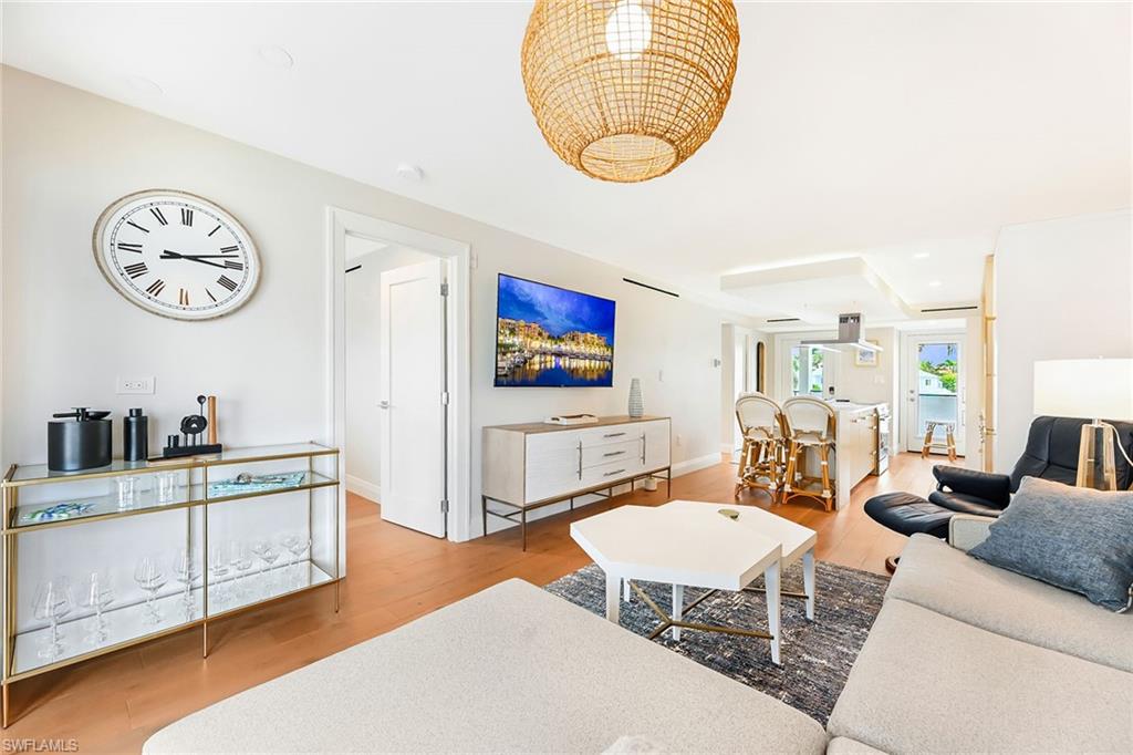 250 7th Avenue South, Unit 207 Naples, FL 34102 - Photo 2 of 25 Great room looking north to kitchen and front door