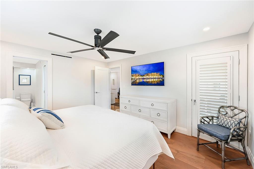 250 7th Avenue South, Unit 207 Naples, FL 34102 - Photo 10 of 25 Master Bedroom with TV