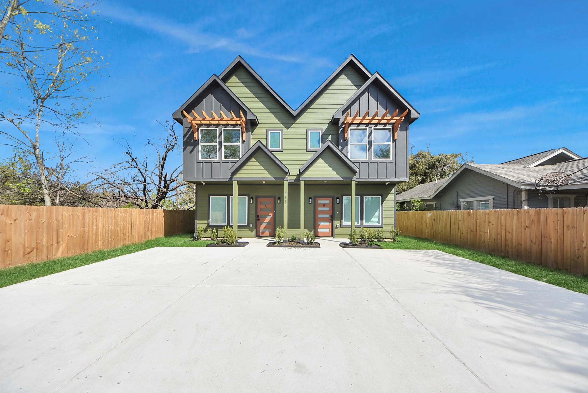 3319 Caplin Street Houston, TX 77026 - Photo 1 of 42 a front view of a house with a yard and garage