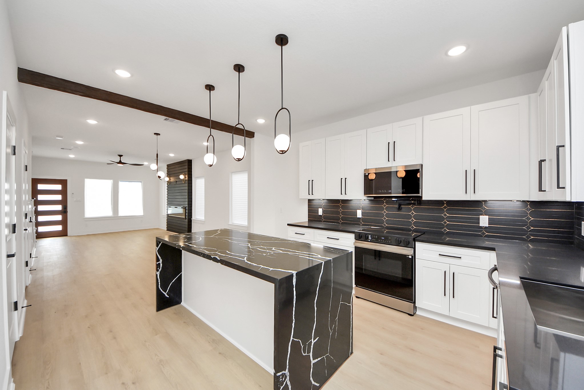 3319 Caplin Street Houston, TX 77026 - Photo 12 of 42 a kitchen with stainless steel appliances granite countertop a sink a stove and a granite counter tops