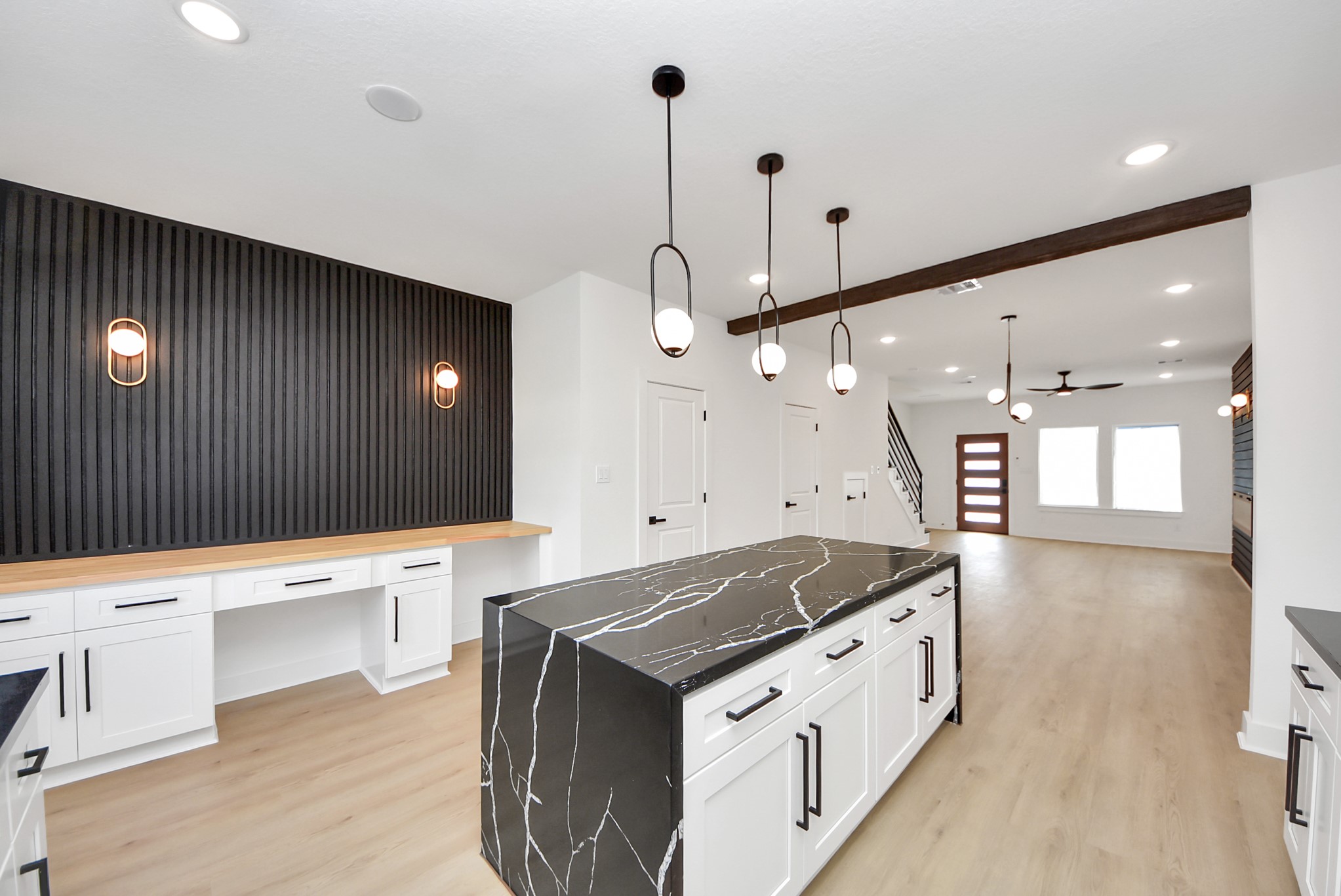 3319 Caplin Street Houston, TX 77026 - Photo 15 of 42 a kitchen with a stove a sink a center island and wooden floor