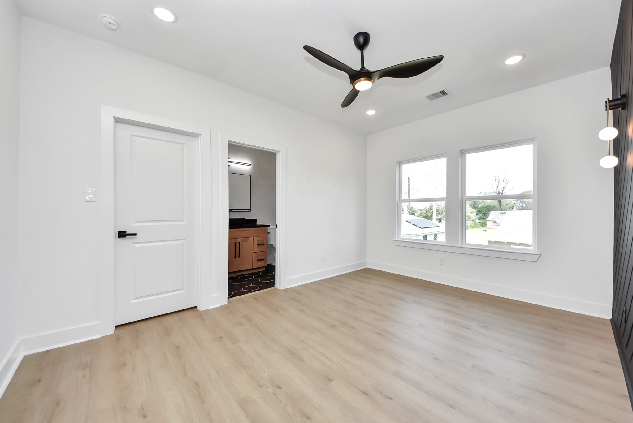 3319 Caplin Street Houston, TX 77026 - Photo 19 of 42 wooden floor in an empty room with a window