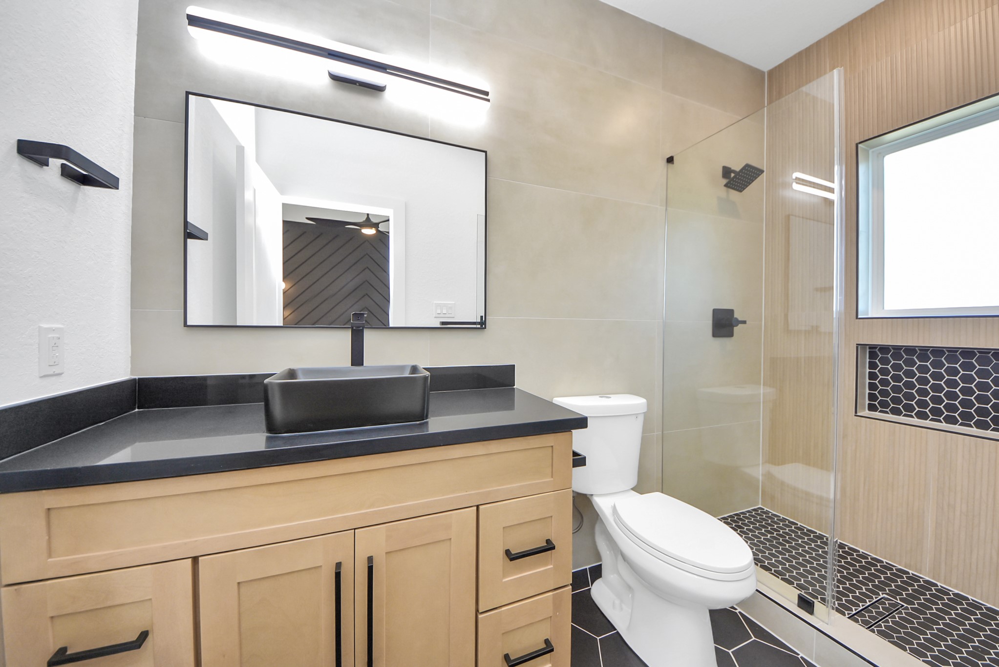 3319 Caplin Street Houston, TX 77026 - Photo 22 of 42 a bathroom with a toilet sink and mirror