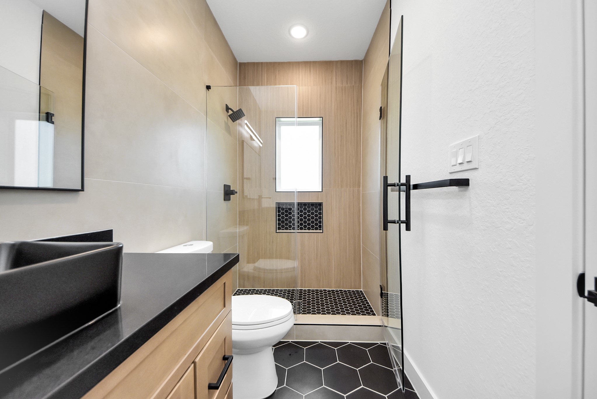 3319 Caplin Street Houston, TX 77026 - Photo 23 of 42 a bathroom with a sink a toilet and shower