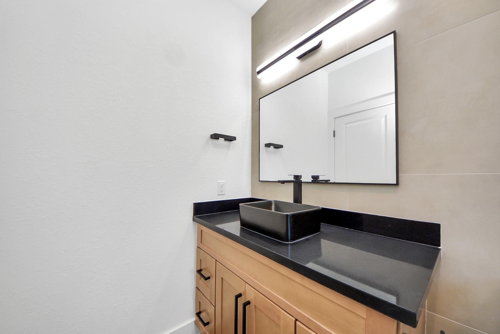 3319 Caplin Street Houston, TX 77026 - Photo 24 of 42 a bathroom with a sink and a mirror