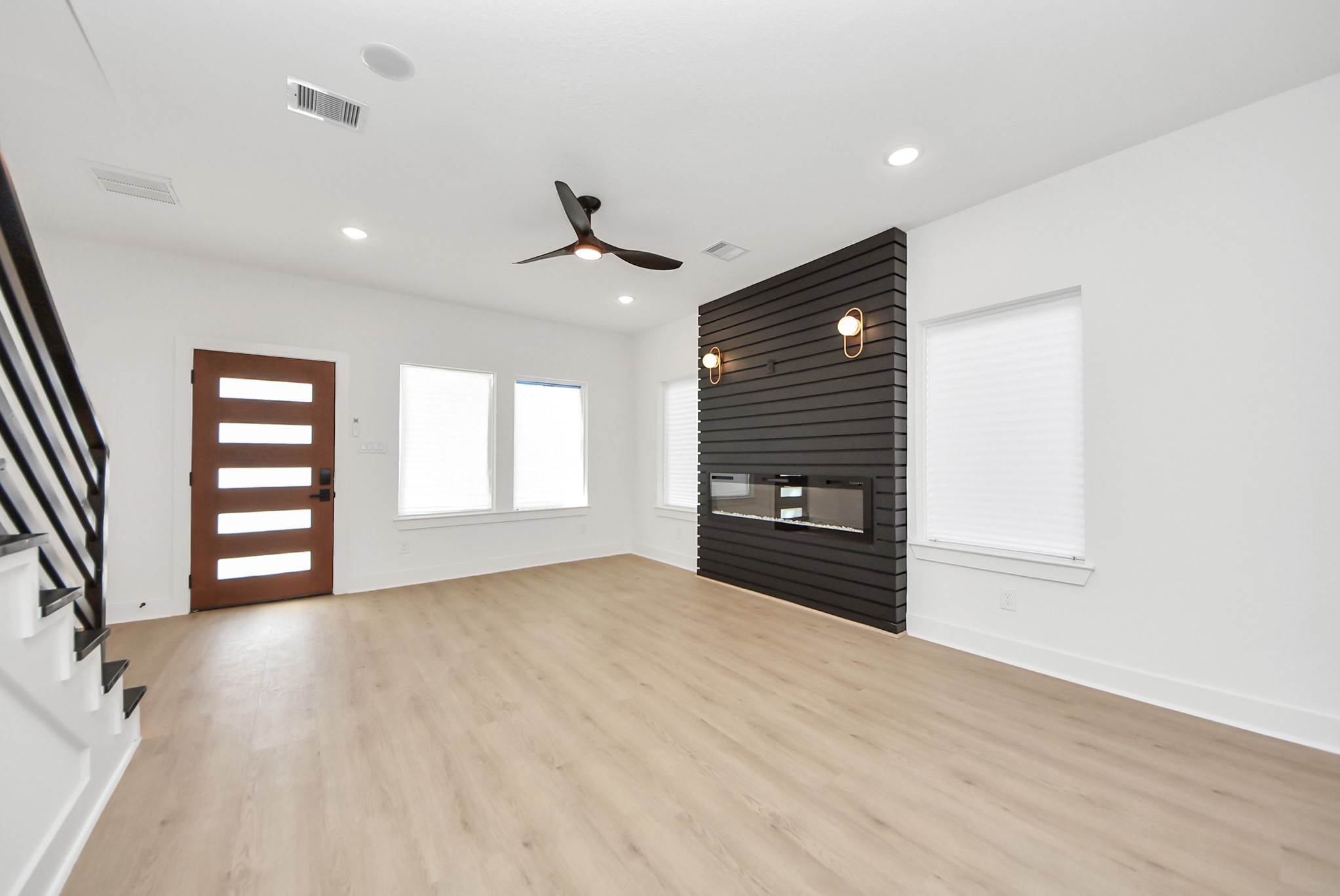 3319 Caplin Street Houston, TX 77026 - Photo 5 of 42 a view of an empty room with a window and fireplace