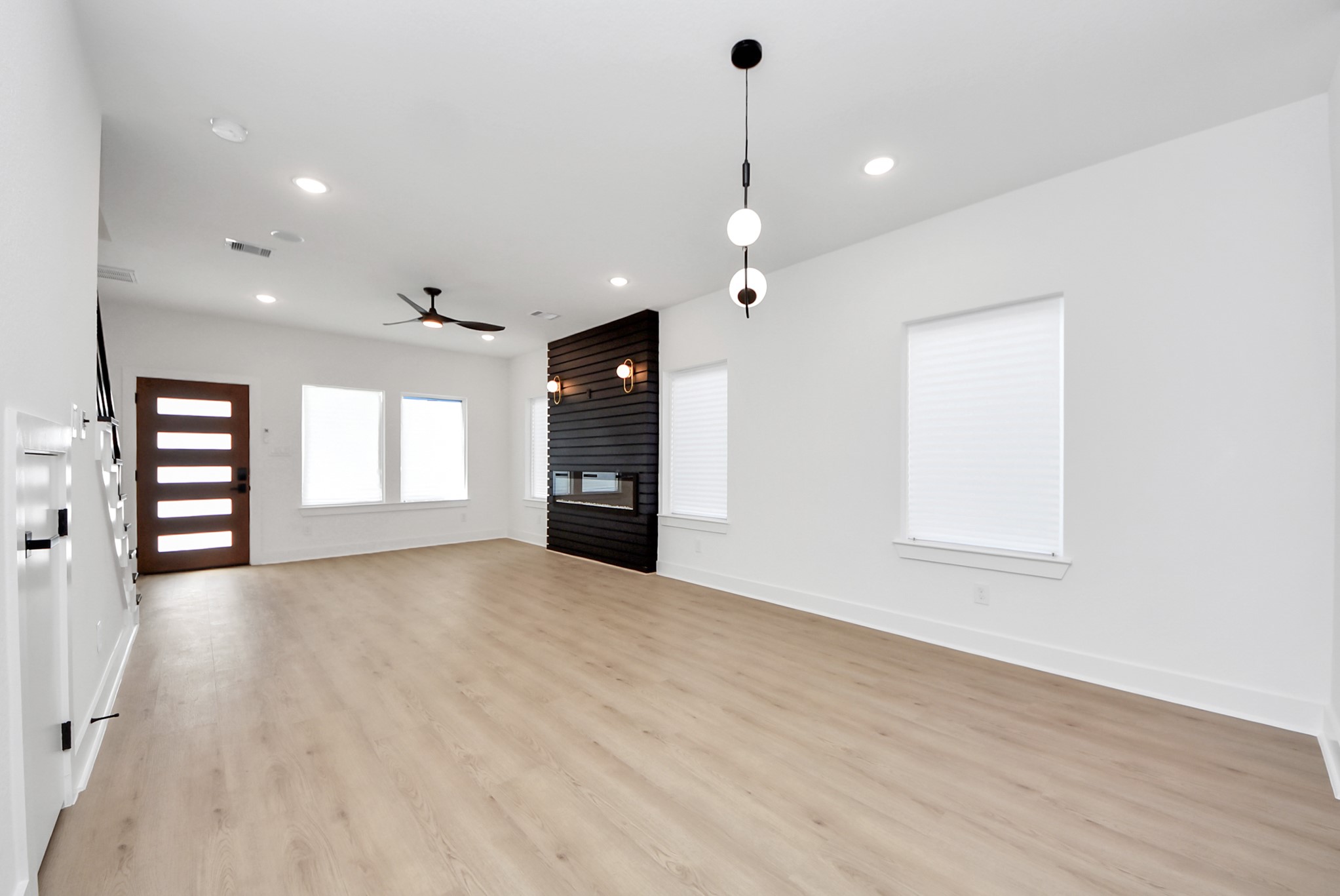 3319 Caplin Street Houston, TX 77026 - Photo 8 of 42 a view of an empty room with a window and fireplace