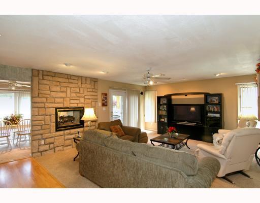 10280 Grubbs Road Wexford, PA 15090 - Photo 9 of 18 Den/Family/Great Room. Open and room family room with dual sided fireplace, hardwood flooring