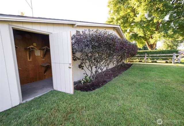 a view of a big yard with a house