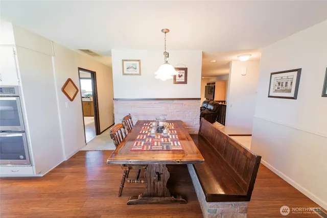 a view of a room with furniture wooden floor and window
