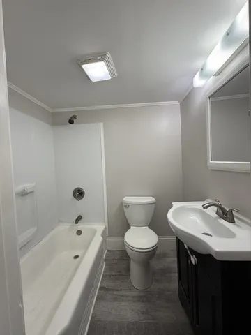 a bathroom with a sink toilet a shower and bathtub