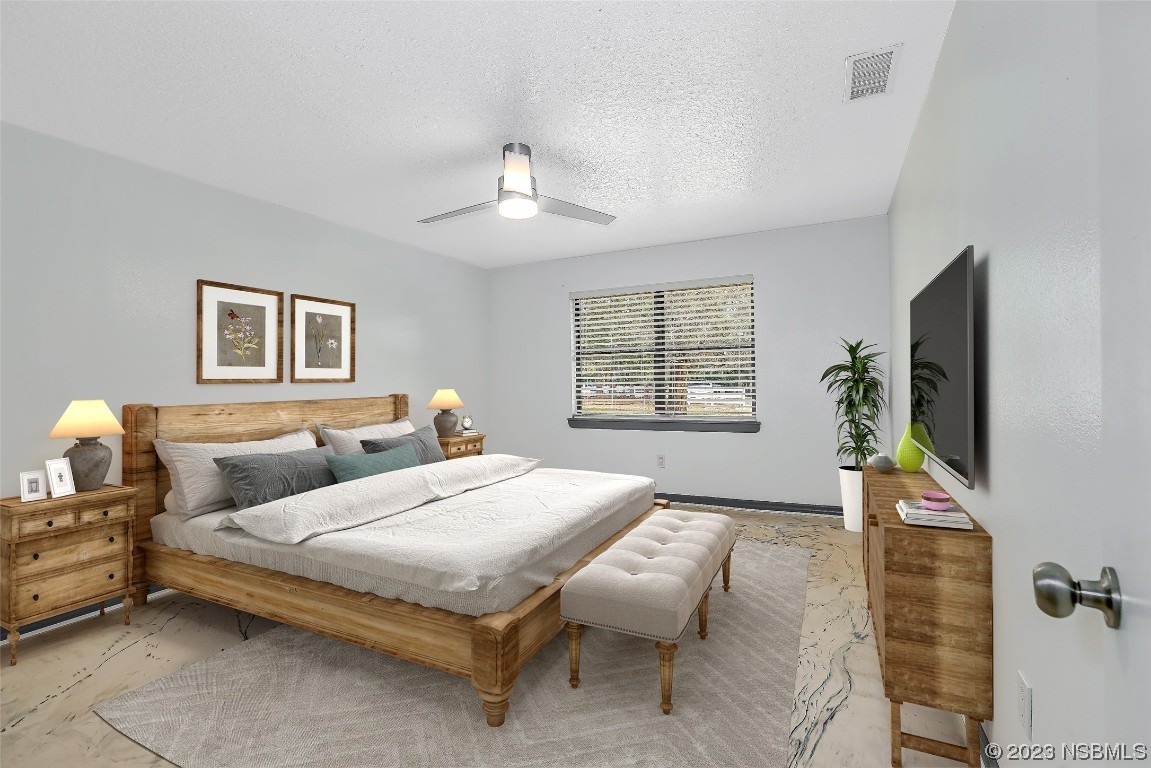 Undisclosed Address Edgewater, FL 32141 - Photo 16 of 37 a bedroom with bed and window