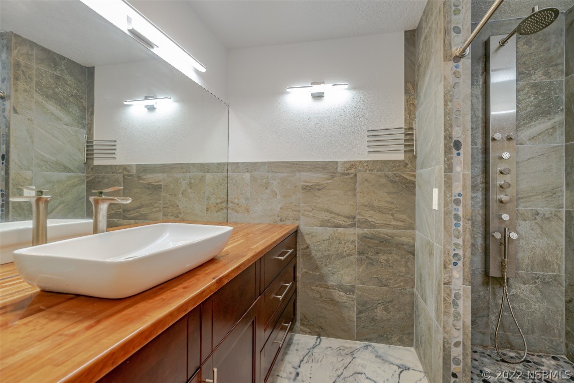 Undisclosed Address Edgewater, FL 32141 - Photo 17 of 37 a bathroom with a sink and a mirror