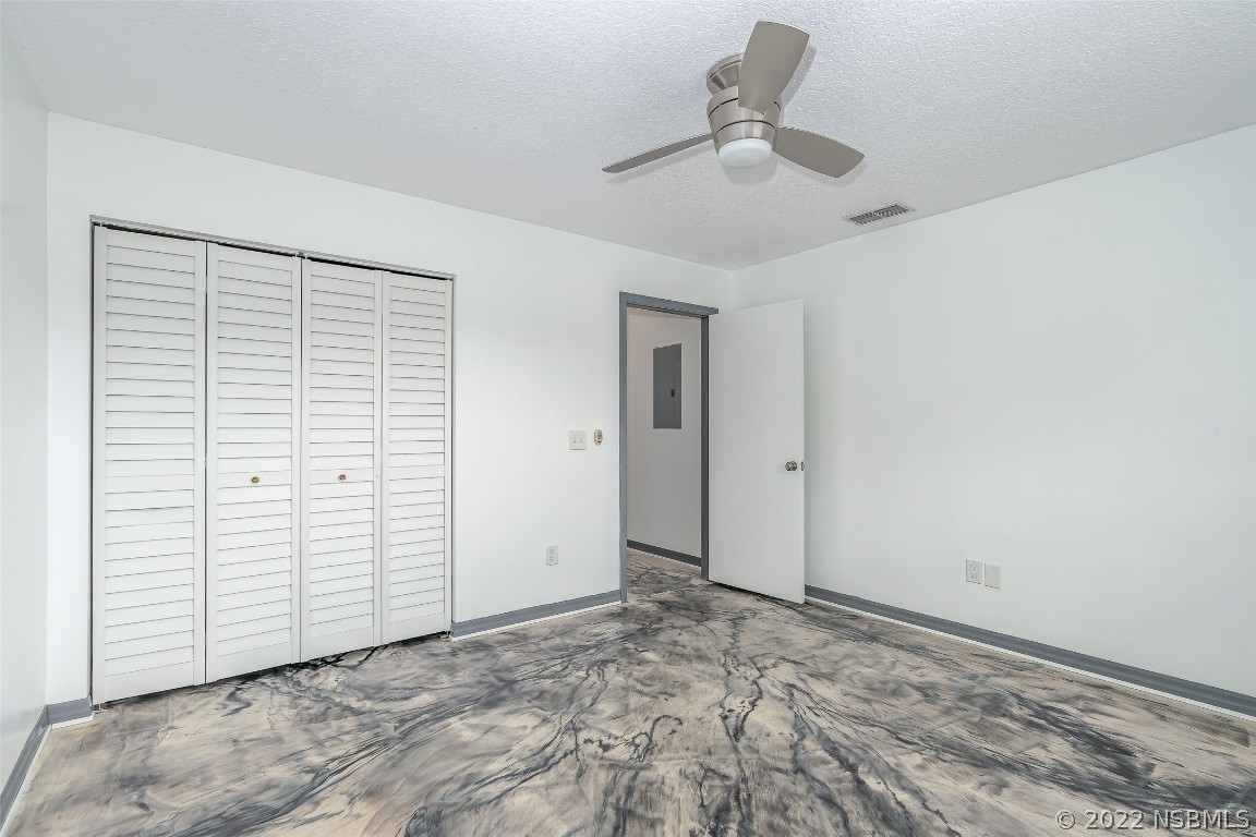 Undisclosed Address Edgewater, FL 32141 - Photo 21 of 37 a view of a livingroom with a chandelier fan
