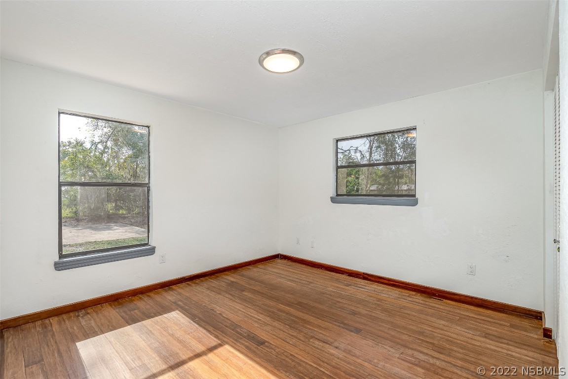 Undisclosed Address Edgewater, FL 32141 - Photo 26 of 37 a view of empty room with wooden floor and fan