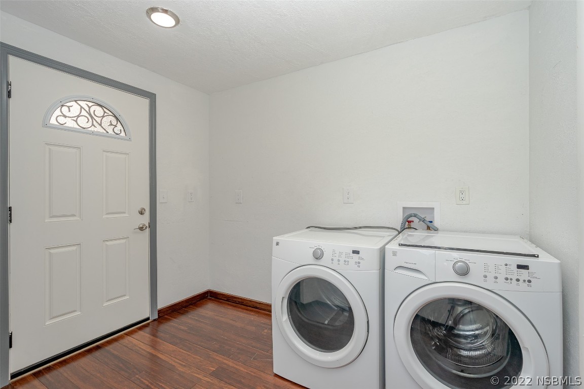 Undisclosed Address Edgewater, FL 32141 - Photo 29 of 37 a view of a hallway with washer and dryer